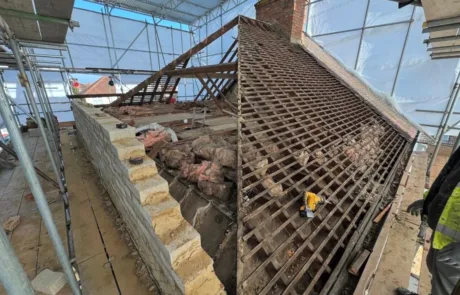 Battens and blockwork upstand visible during Sutton loft conversion works.